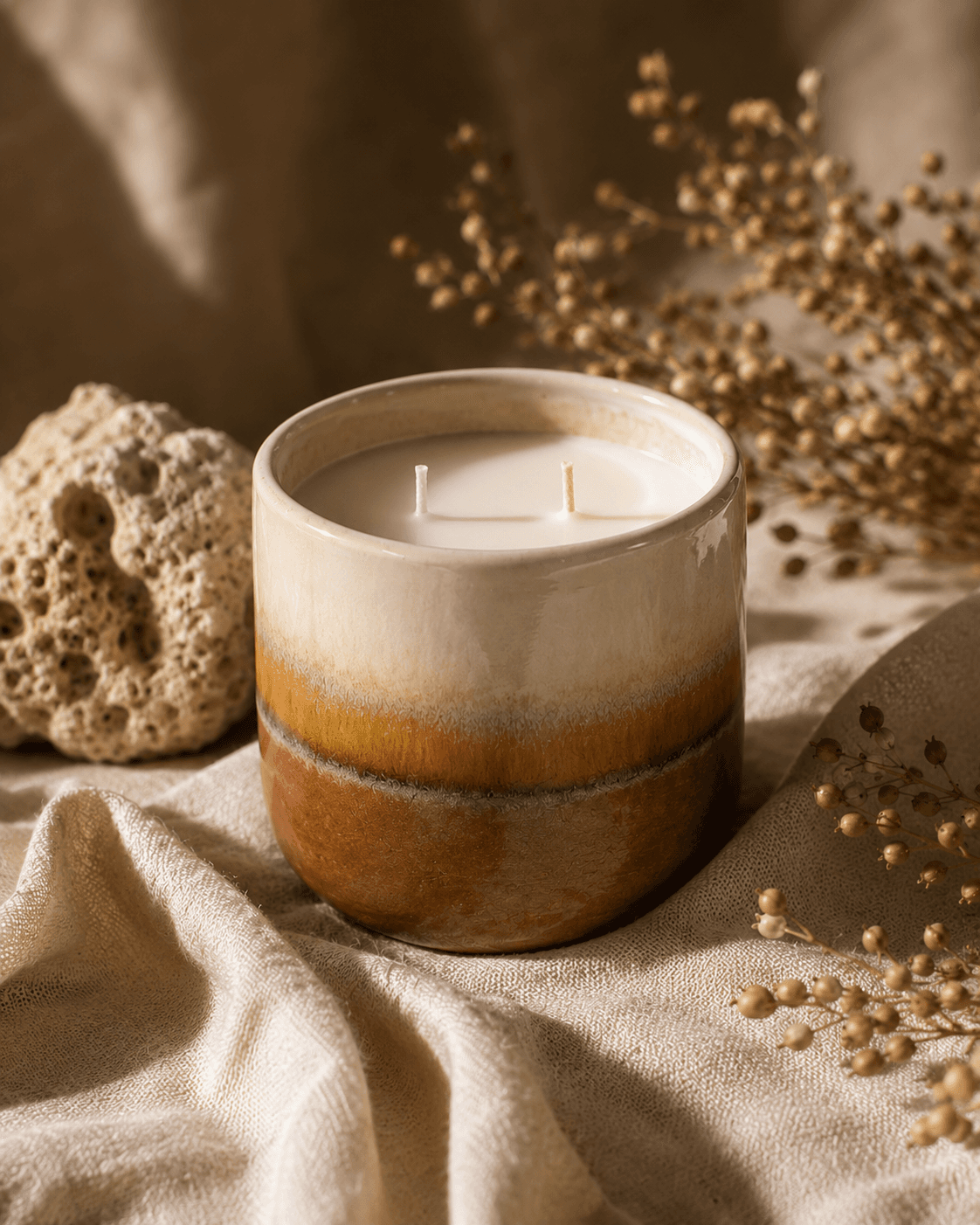 Island Mist Sensora candle in a glazed clay vessel