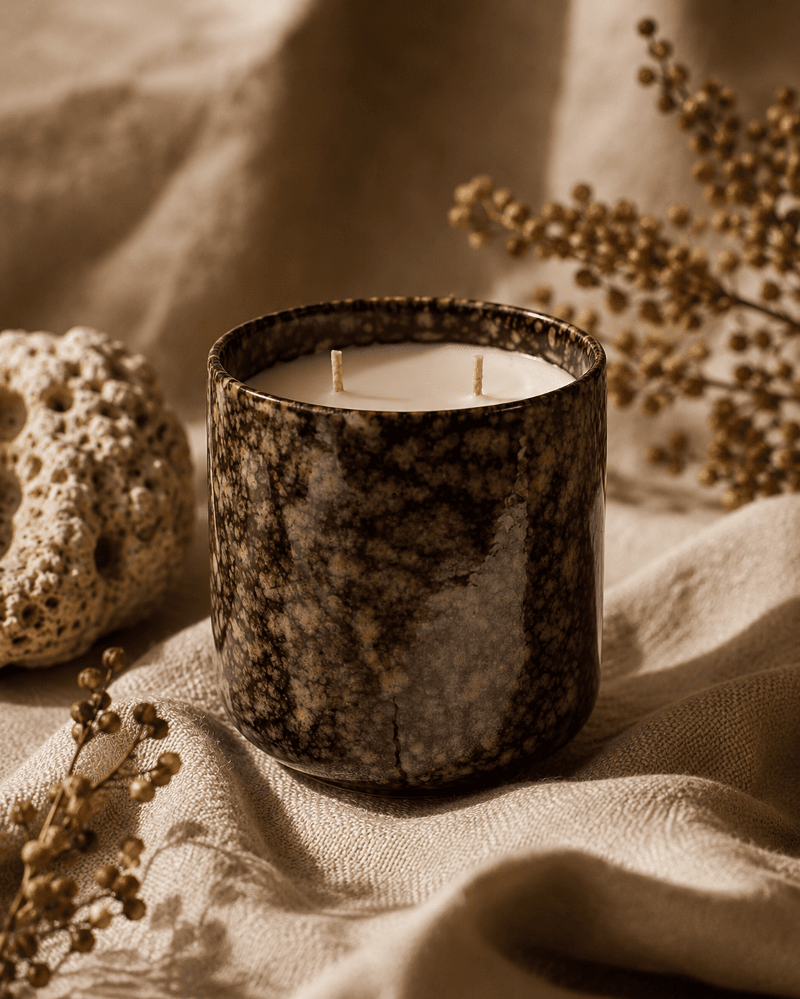 Sun Kissed Sensora candle in a glazed clay vessel